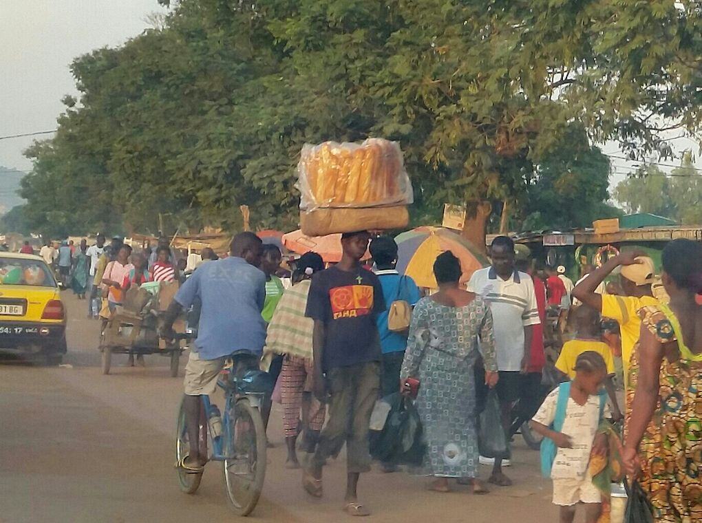 people talking on crowded street
