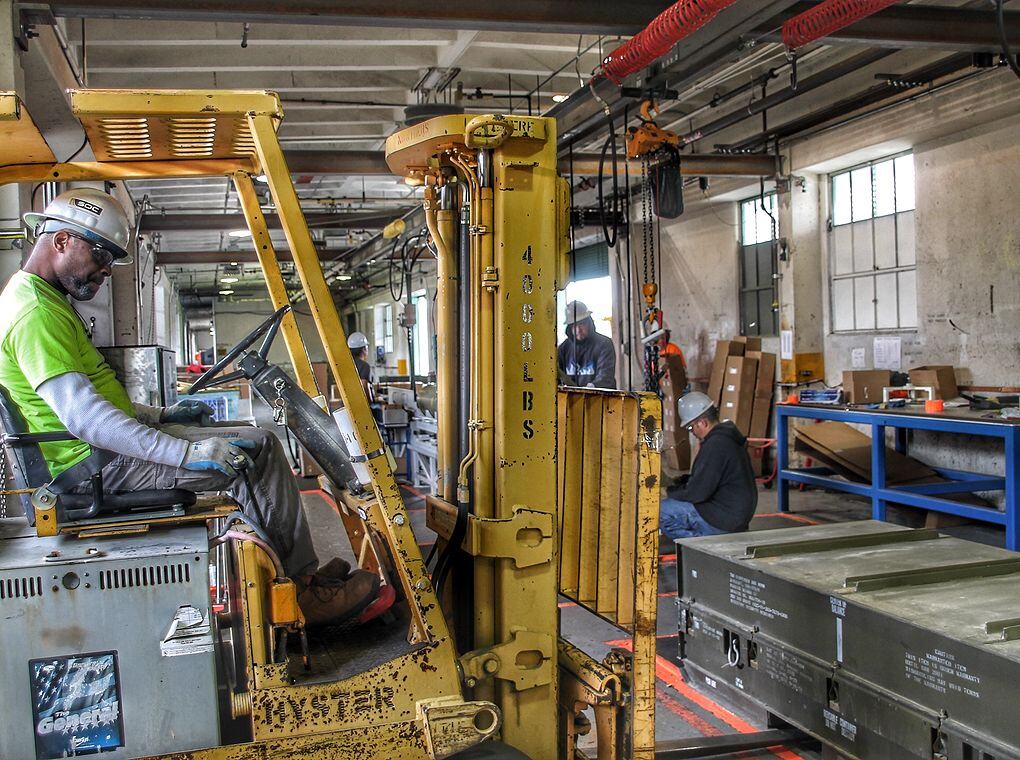 forklift and forklift operator in factory