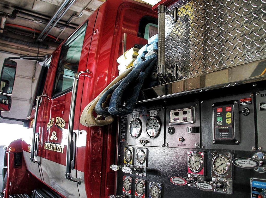 fire hoses loaded onto a fire engine
