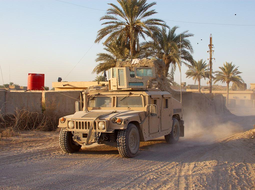 military vehicle in on desert road