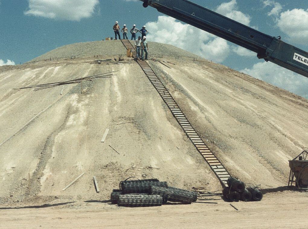 workers on sandy hillside