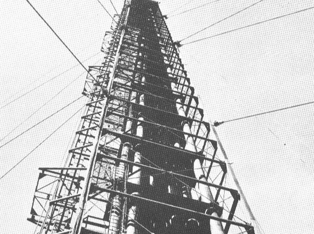 metal tower anchored by cables